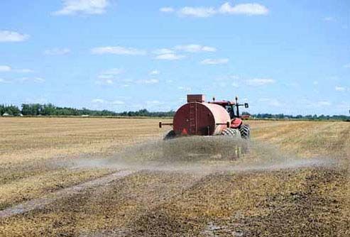 A Florida Fertilizer truck sprays a field.